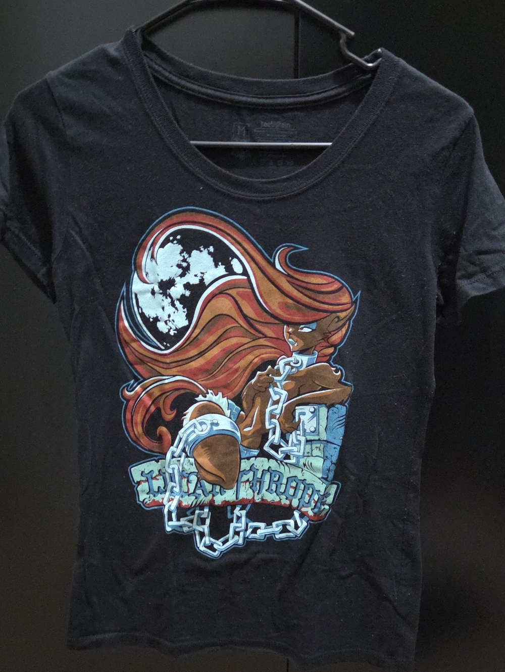 Graphic Black Tee with Red-Orange Illustrated Woman